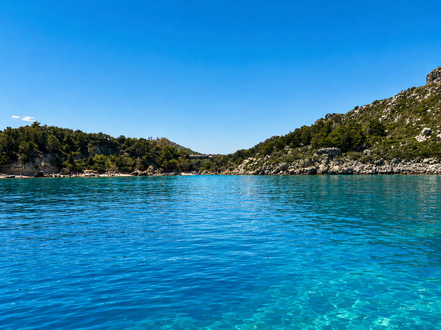 Anthony Quinn Bay turquoise water seen from the sea