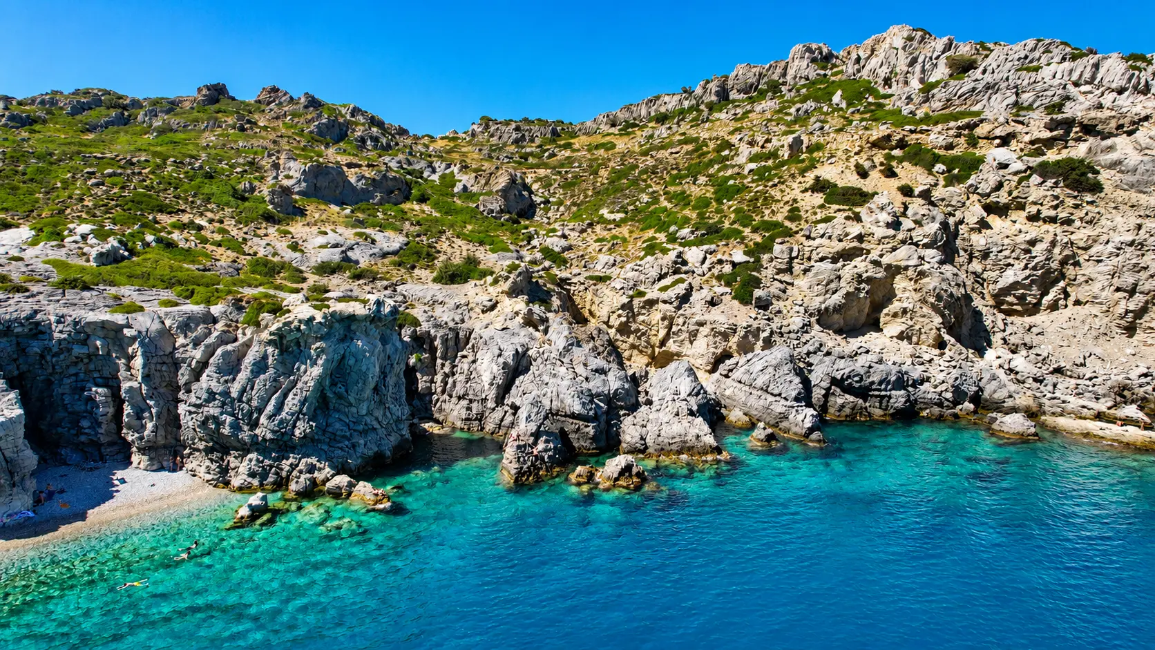 Traganou sea caves and bright clear water along the rocky coast